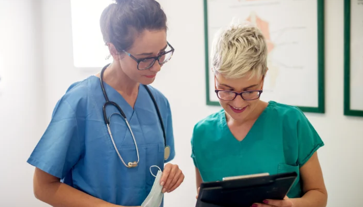 Clinical research staff looking at a clipboard
